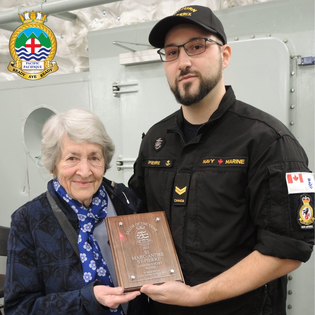 Sailor 1st Class Marc-Andre St-Pierre of NRU Asterix receives the Sailor of the Year Award for 2023 from Mrs. Geraldine Hinton during a ceremony aboard the vessel on Feb 22. Photo: Peter Mallett / Lookout