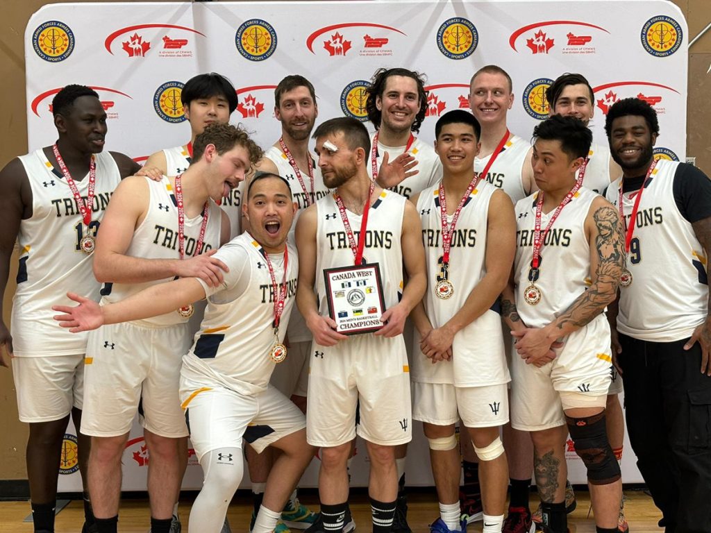 Members of the Esquimalt Tritons men’s basketball team celebrate their 76-44 victory over Cold Lake in the championship game of the Canada West Regional Basketball Championship