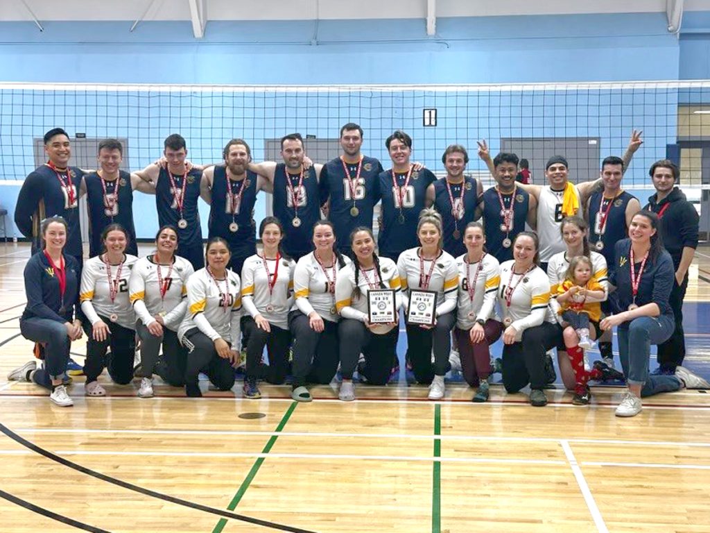 Members of the Esquimalt Tritons women’s and men’s volleyball teams celebrate their Canada West Regional Volleyball Championship victories