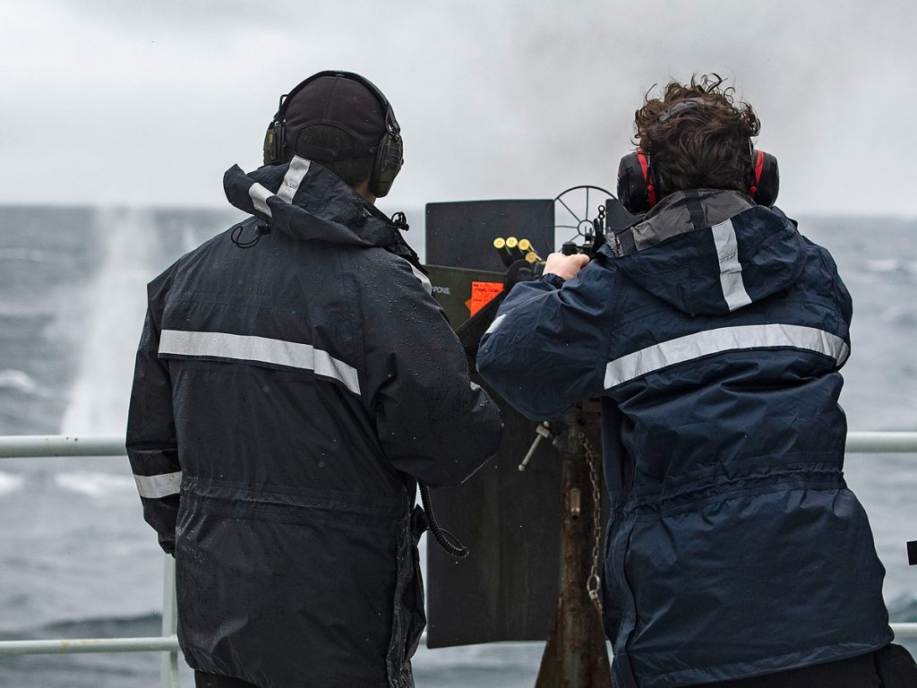 Royal Canadian Navy members run members of the NEP through a .50 Cal familiarity shoot.
