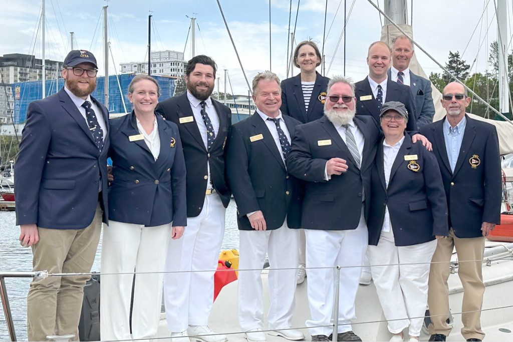 CFSA leadership past and present gather for a group photo on the jetty. (Top Row from Left) Ginette Gibeault