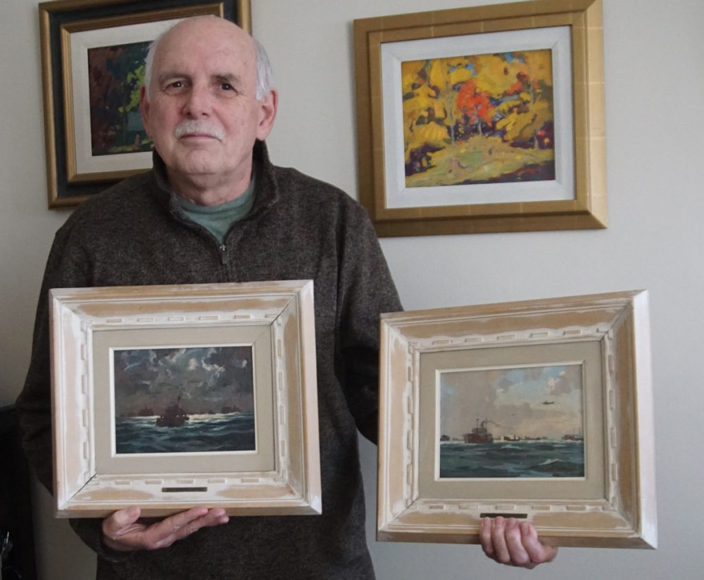 David Emmerson holds his pair of LCdr Riordon paintings numbers 18 and 12 in the Convoy series. It was their purchase in 2020 that got him started on the project of researching their origins.
