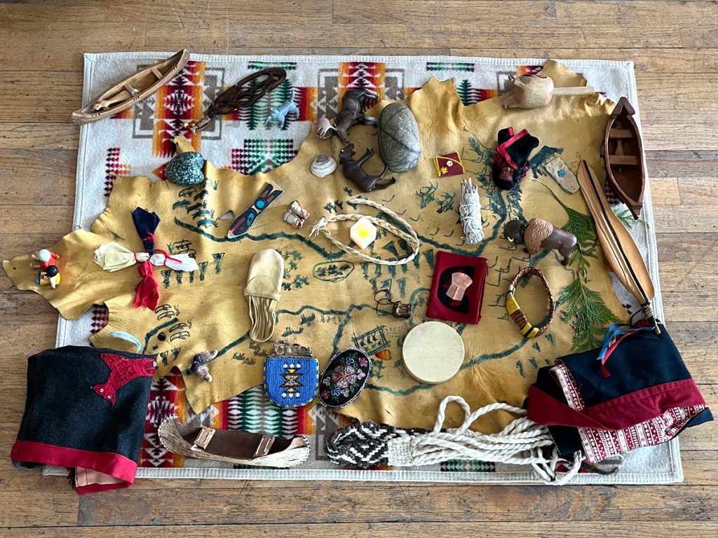 Items are displayed on the village cloth. Photos: CFB Esquimalt Public Affairs.