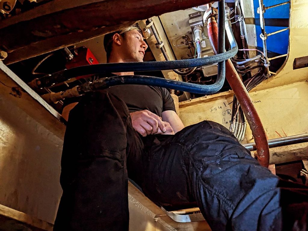 Sailor 1st Class Danny Dubeau performs diagnostics on the thermal couple sensor which monitors the temperature inside one of HMCS Vancouver’s gas turbine engines while at sea on the way to San Diego in June.