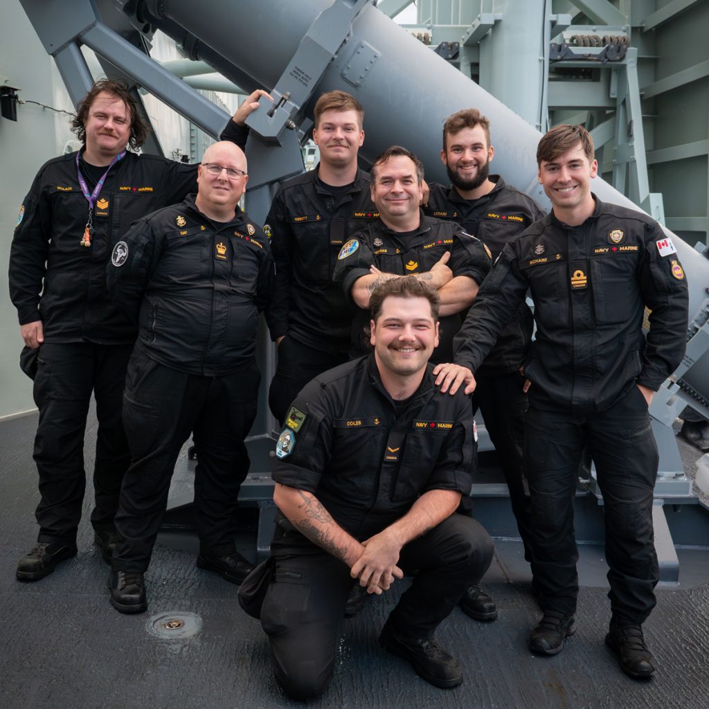 Group photo of HMCS Regina’s Naval Electronic Sensor Operators and supervising Officer