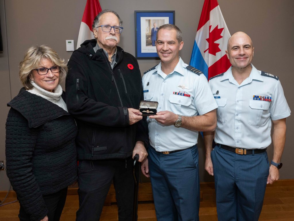 Mr. Jay Hammond recieves a set of wings created using the aluminum of his uncle's recovered Halifax bomber during a Commendation Presentation at 443 Maritime Helicopter Squadron on Oct. 18. Photo: Sailor 3rd Class Jordan Schilstra